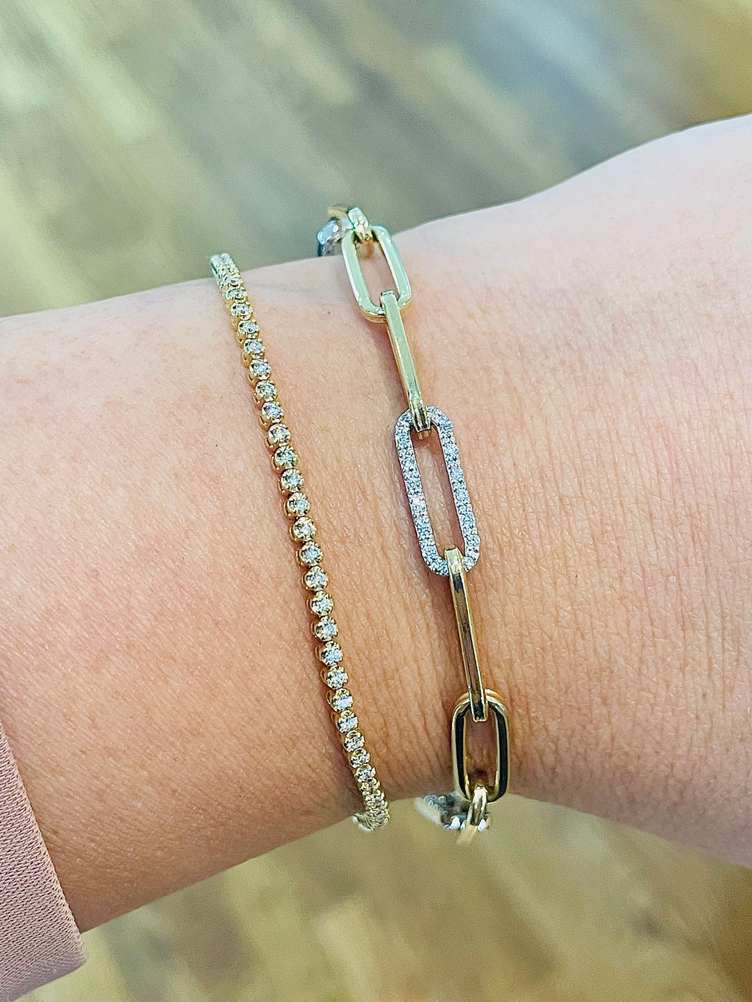 Diamond Triple Link Paperclip Bracelet layered with a buttercup tennis bracelet