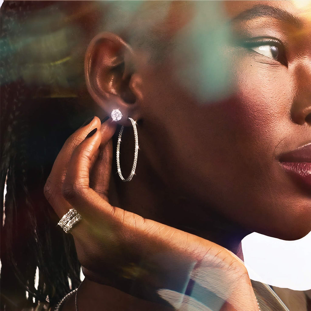 Lab-grown diamond martini (3-prong) stud earrings, 1.50 ctw, 14K white gold, on model.