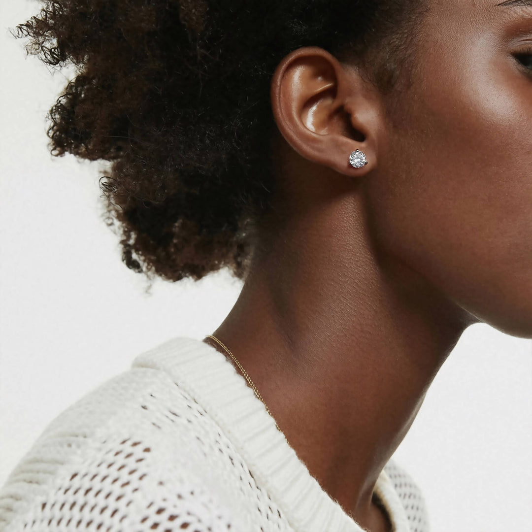 Lab-grown diamond martini (3-prong) stud earrings, 4 ctw, 14K white gold, on ear.