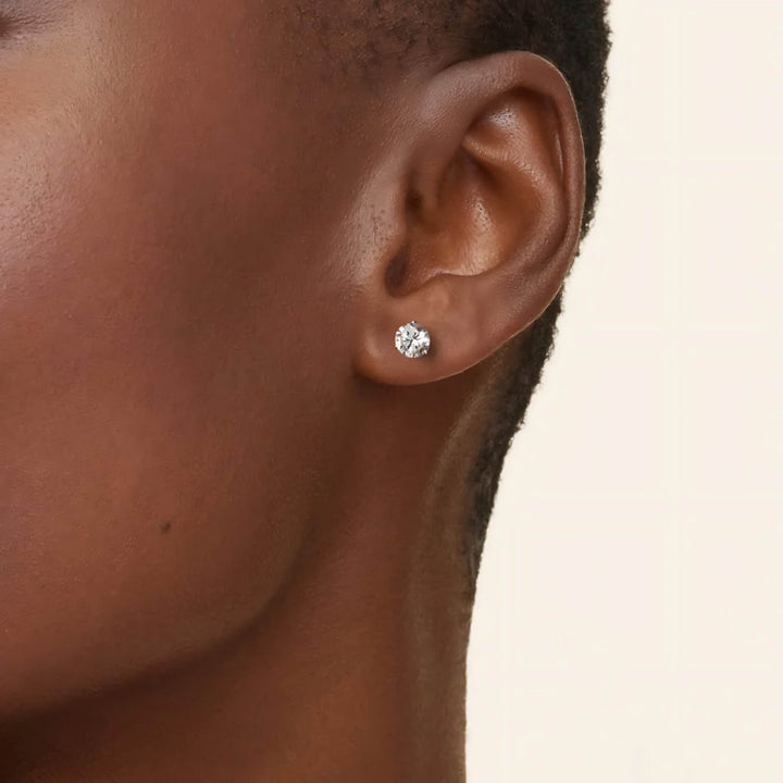 Lab-grown diamond martini (3-prong) stud earrings, 1 ctw, 14K yellow gold, on ear.