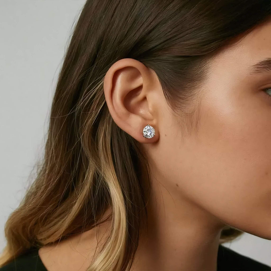 Lab-grown diamond martini (3-prong) stud earrings, 6 ctw, 14K yellow gold, on ear.